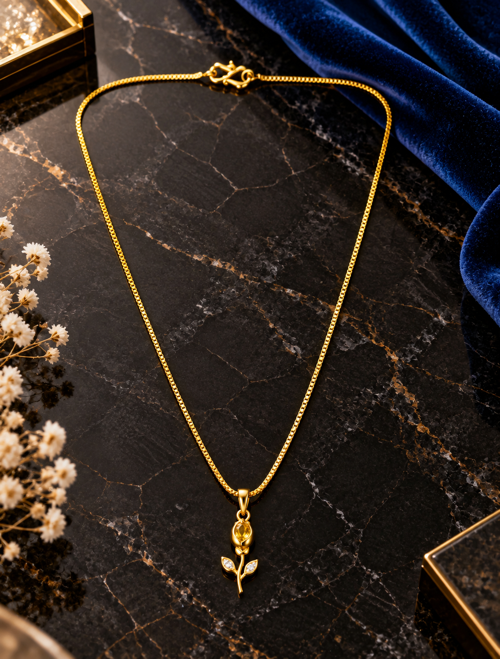 Rose shaped pendant on top stone in a gold plated chain